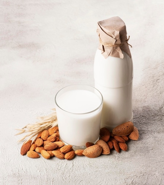 Almonds milk and oat milk on concrete backgrounds