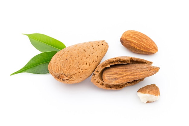 Almonds with leaves isolated on white background