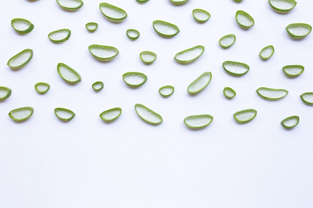 Aloe vera slices on white background.