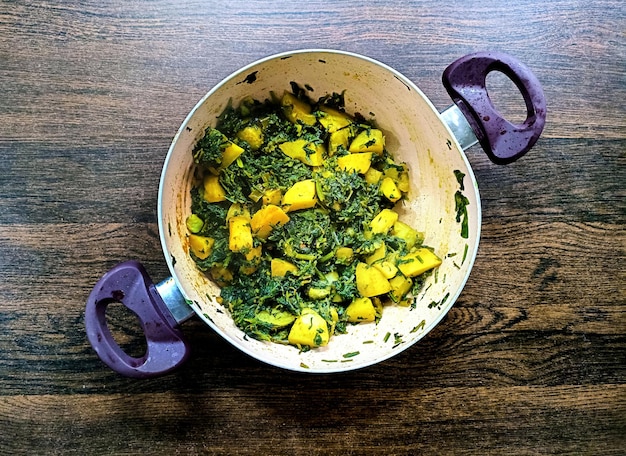 Aloo Palak sabzi Potato cooked with spinach with added spices a healthy Indian main course recipe