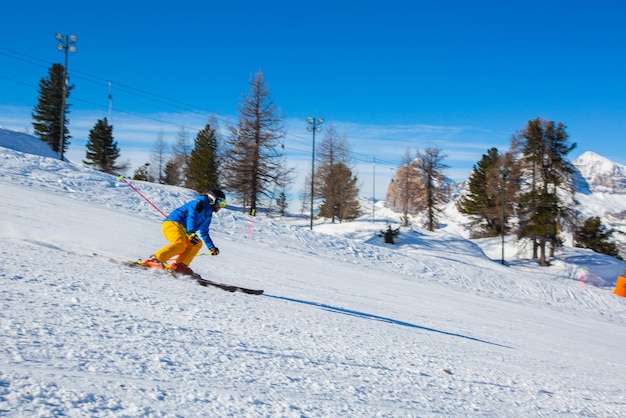 Alpine skier on slope at Cortina