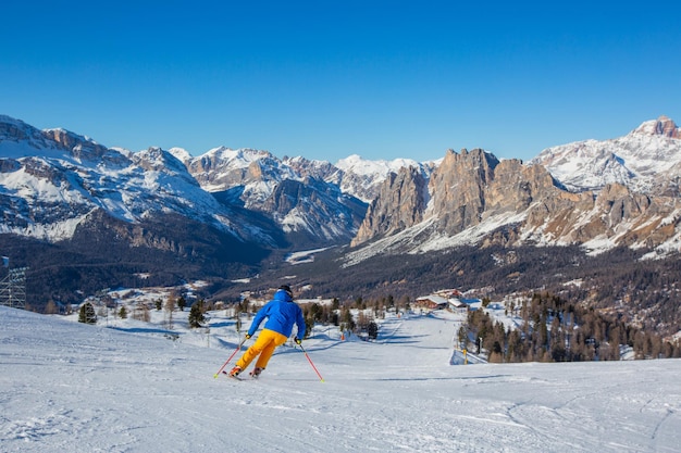 Alpine skier on slope at Cortina