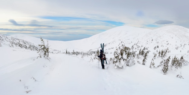 Alpine touring skier in winter mountains. Carpathians, Ukraine.