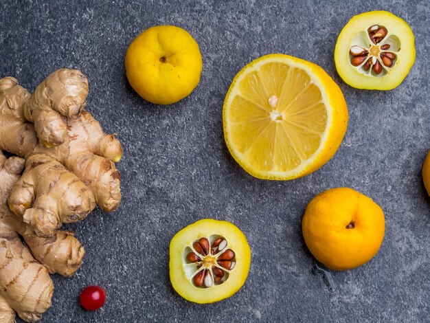 Alternative Medicine ingredients for a spicy warming tea in the winter day healthy eating concept red berries cydonia lemon ginger