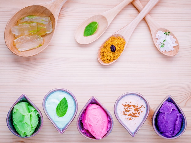 Photo alternative skin care and homemade scrubs on wooden table.