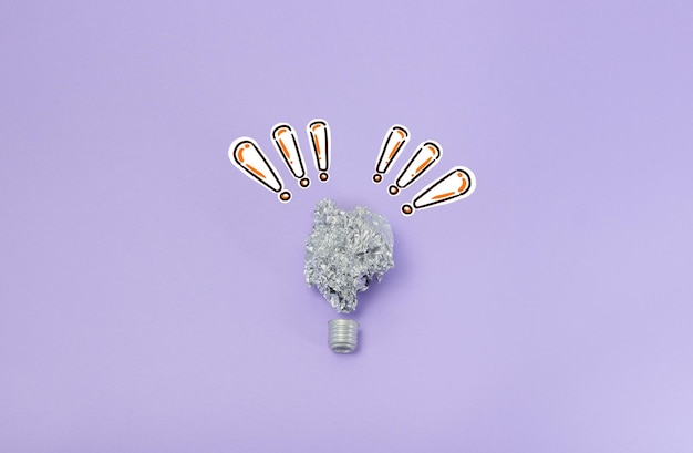 Aluminum foil light bulb with exclamation marks