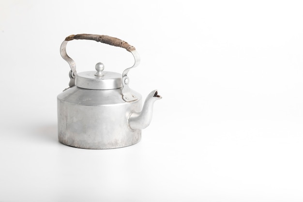 Aluminum tea kettle on white surface