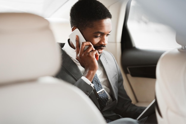 Always Available Businessman Having Business Talk In Car