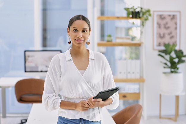 The always powercrazed middle aged generation Shot of a businesswoman holding a digital tablet in a modern office