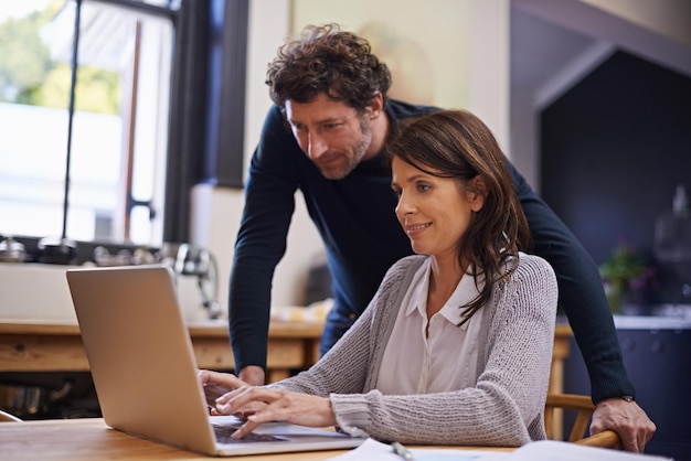 Always sticking to their budget Shot of a young couple doing their finances at home