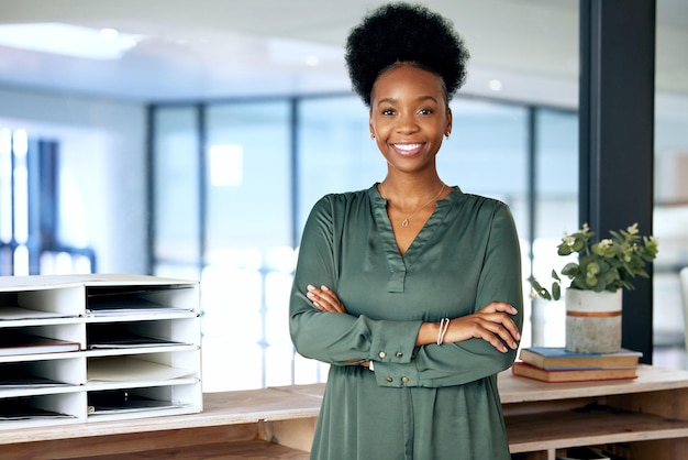 Always taking care of my business Shot of a young businesswoman standing in an office at work