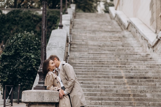 Always together Rear view of beautiful young couple bonding and looking at each other in Paris