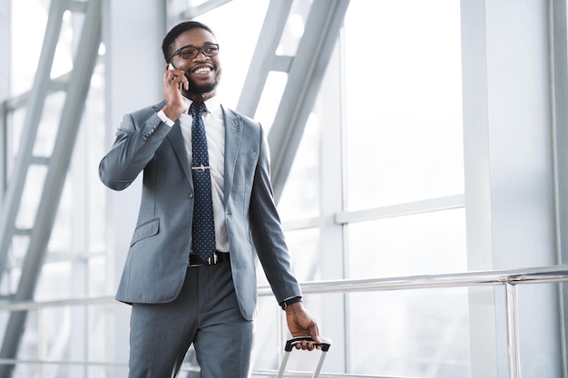 Always in Touch Busy Man Talking on Phone in Airport