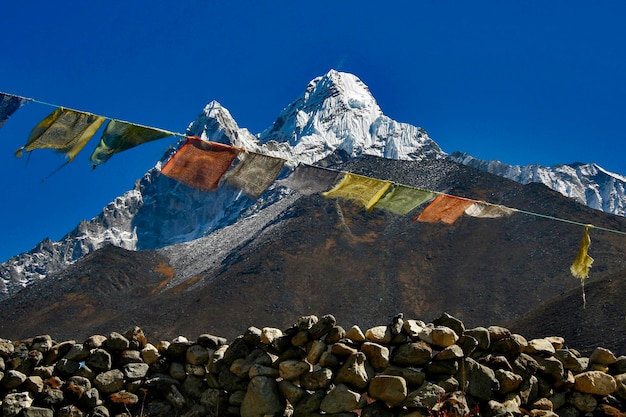 Ama Dablam 6856 meters high with prayer flags in Nepal