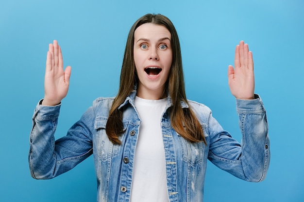 Amazed female showing big size gesture with hands