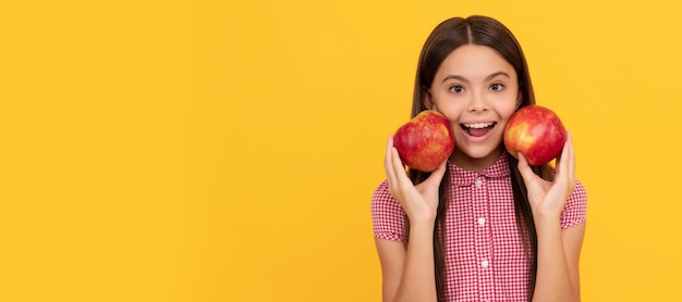 Amazed teen girl hold healthy apple fruit Child girl portrait with apple horizontal poster Banner header with copy space