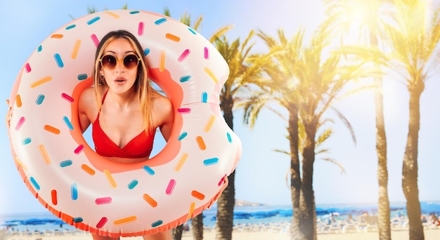 Amazed woman exits from an inflatable donut