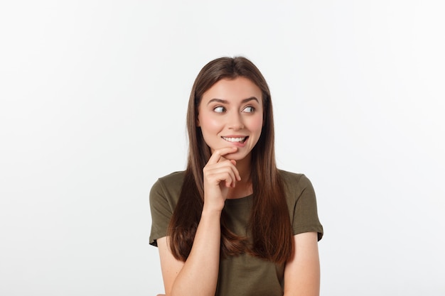 Amazement - woman excited looking to the side. Surprised happy young woman looking sideways in excitement. 