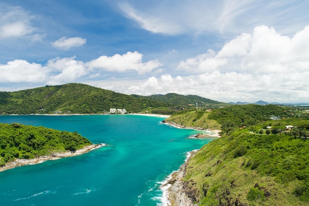 Amazing Aerial view of sea waves hitting rocks with turquoise sea water Beautiful seascape in the Phuket island coastline Thailand Travel and tour concept