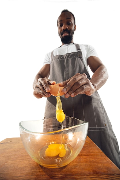 Amazing african-american man preparing unbelievable food with close up action, details