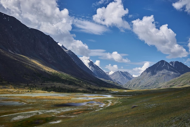 Amazing alpine landscape mountains of Mongolia panorama of the mountain valley river amazing views of the valley in summer Hiking wildlife ice peak