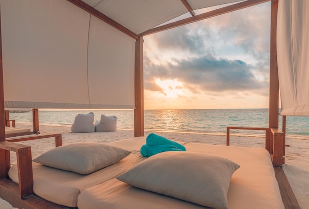 Amazing beach canopy, leisure lifestyle summer vacation. Sunset colors, sea sand sky beach resort