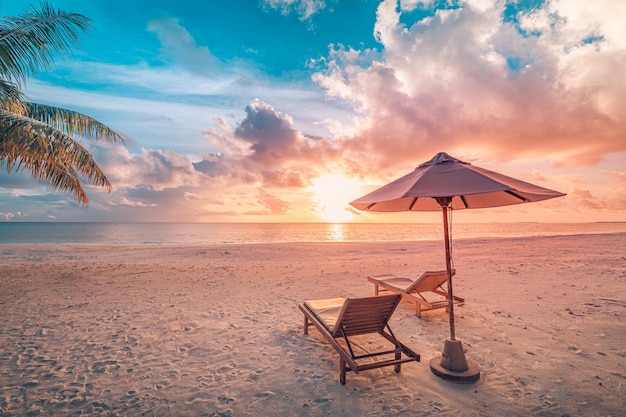 Amazing beach Couple chairs on the sandy beach sea sky Luxury summer holiday and vacation resort