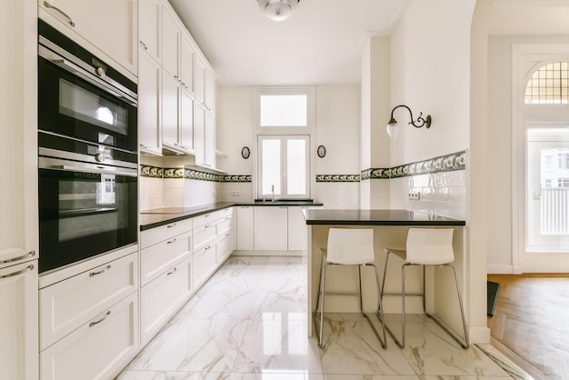 Amazing design of a large kitchen with lots of cabinets