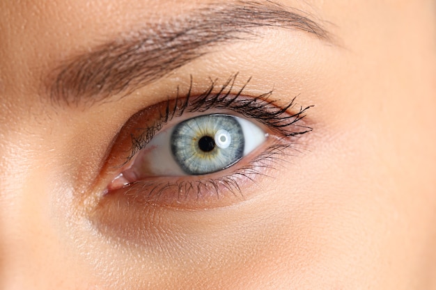 Amazing female blue and green colored eye close-up