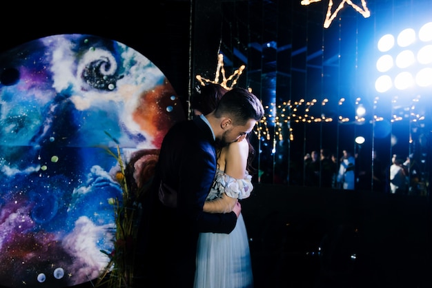 Amazing first wedding dance on heavy smoke with beautiful light and Athos. Decor in the style of space. Space wedding