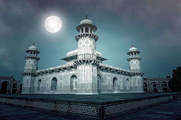 Amazing marble Tomb of ItimadudDaulah or Baby Taj Mahal in the night with moon in Agra India Collage