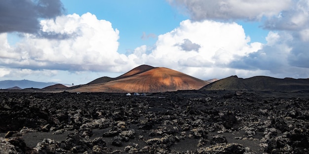 Amazing panoramic landscape of volcano craters in timanfaya national park popular touristic attracti