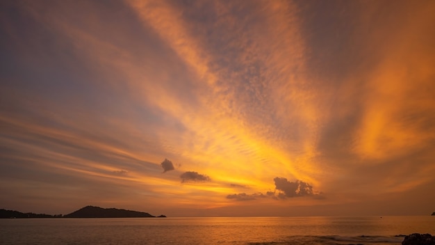 Amazing seascape with sunset clouds over the sea with dramatic sky sunset or sunrise Beautiful nature minimalist background and texture Panoramic nature view landscape Dramatic light sky and clouds.