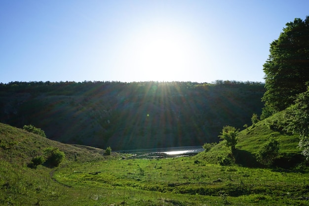 Amazing spring view of the canyon of the Dniester River with picturesque hills fields forests Chernivtsi region Ukraine