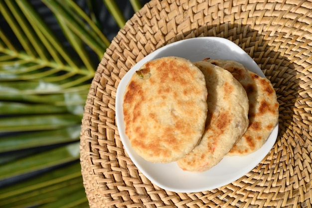 Amazing Sri Lankan three pol coconut roti in white plate Authentic recipe