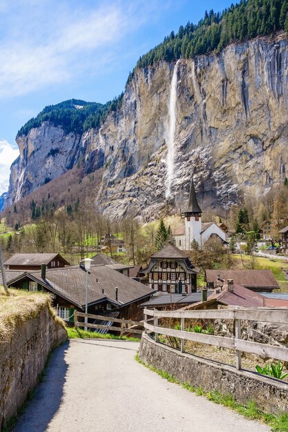 amazing touristic alpine village with church and Staubbach waterfall