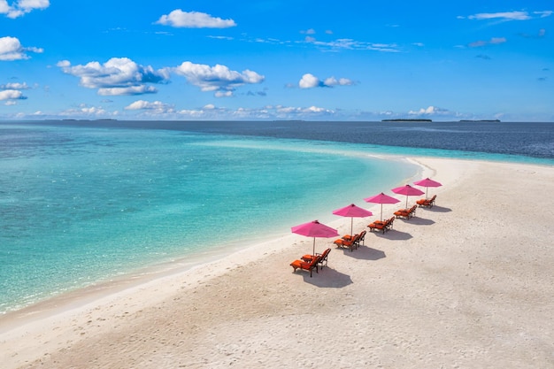 Amazing tranquil sea sand sky. Recreational summer travel tourism. Aerial landscape view with chairs