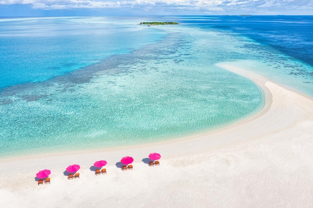 Amazing tranquil sea sand sky. Recreational summer travel tourism. Aerial landscape view with chairs