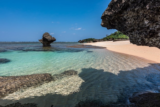 Amazing tropical beach crystal clear sea water natural pool formed by corals sunny day