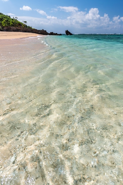 Amazing turquoise crystal clear sea water at a paradise beach in a sunny day