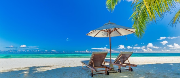 Amazing vacation beach. Chairs on the sandy beach near the sea. Summer romantic holiday tourism