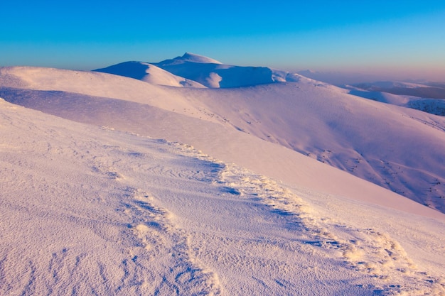 Amazing winter snowy scenery of famous and popular touristic landmark old desolate observatory on mountain Pip Ivan in Chornogora mountain ridge in Ukrainian Carpathian national park