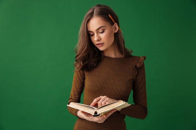 Amazing young woman reading book.