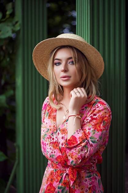 Amazing young woman with dress and hat