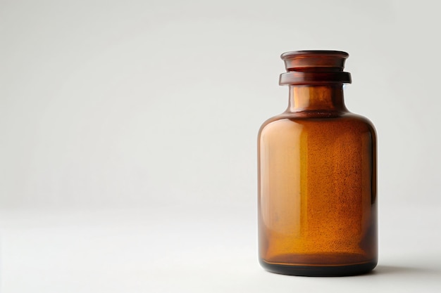 Photo amber apothecary bottle with a glass stopper is standing on a white background