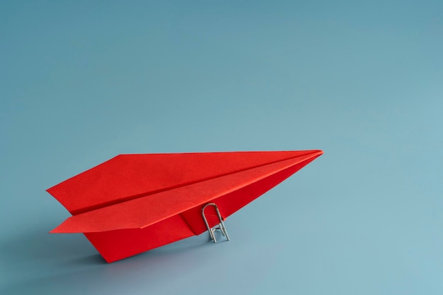 Ambition and goal concept with red paper plane on blue background 3d rendering