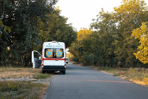 An ambulance car is parked on the side of the road.