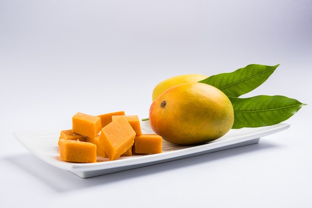 Ambyachi vadi or mango burfi or barfi or cake from India is made using authentic alphonso fruit mixed with Khoya. Served in a plate, selective focus