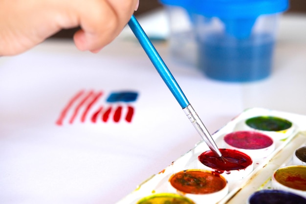 Photo the american 4th of july flag is painted with watercolors by a childs hand patriotism independence day flag day concept day of remembrance