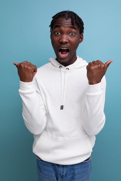 American consultant with dreadlocks shows with his hands for having an idea on a studio isolated